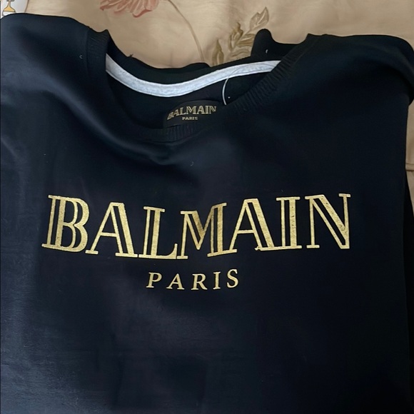 Black sweater with Gold Logo